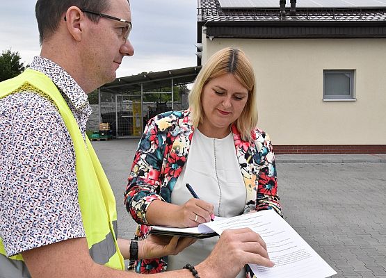 Protokół podpisują: M. Włusek